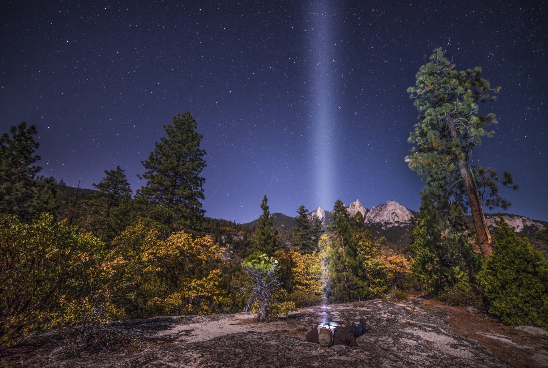 nature national park rock sky star man is flashlight