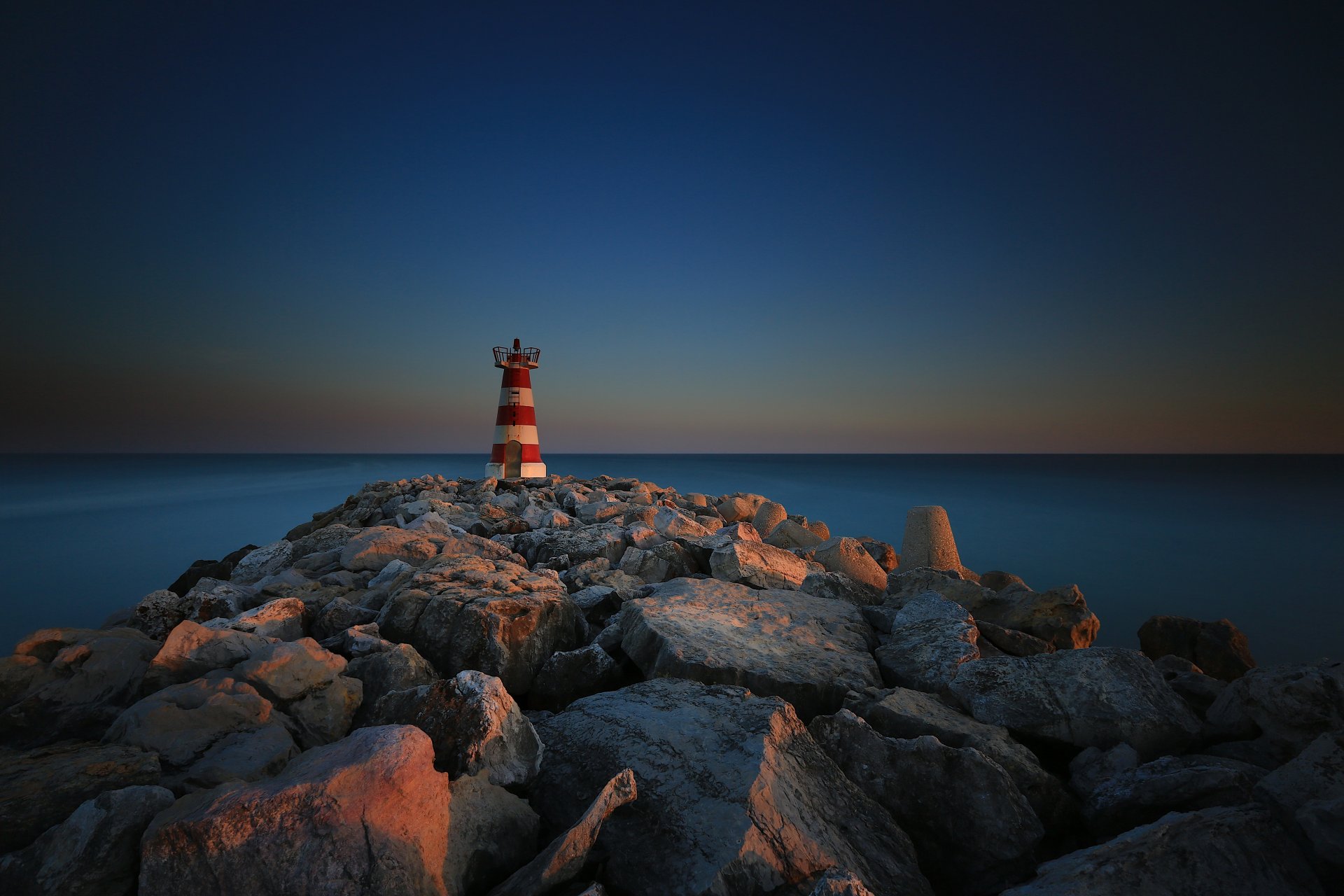 portugal vilamoura faro pt breakwater stones lighthouse sea