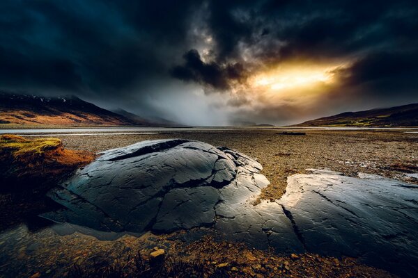 Small mountains and a threatening sky