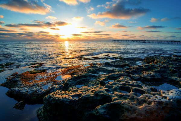 Clouds on the background of sunset in the ocean