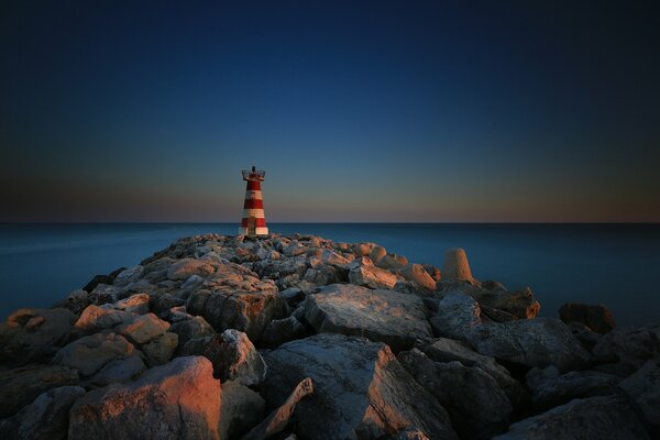 Rocky road to the lighthouse in Portugal