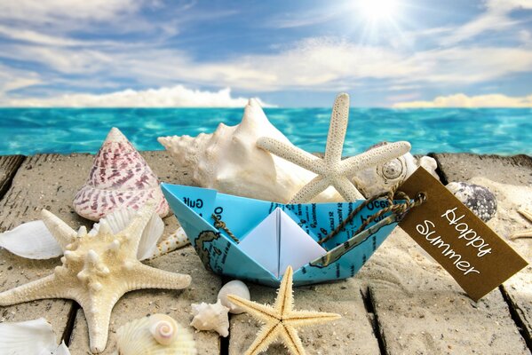 The sun and stars on the sea. Beach with seashells and starfish 