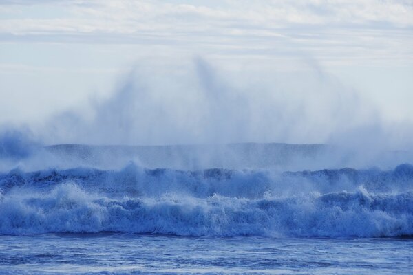 Triple sea foam blue waves with a heap of small splashes