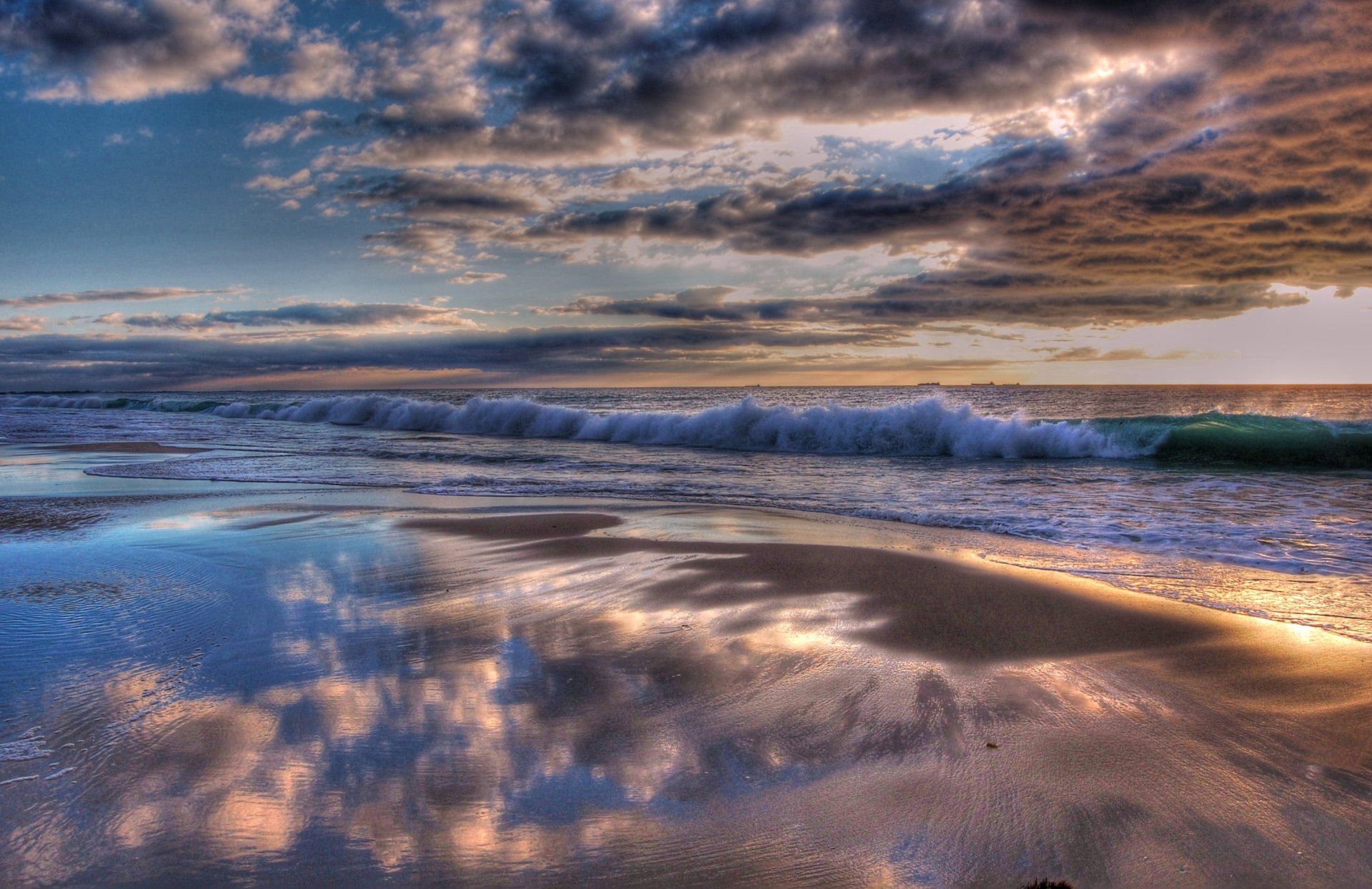 indian ocean water waves shore clouds clouds sunset