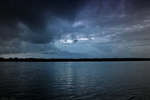 Night sky in the moonlight in the lake