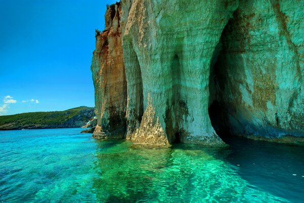 Beautiful cliffs by the sea with a green tint