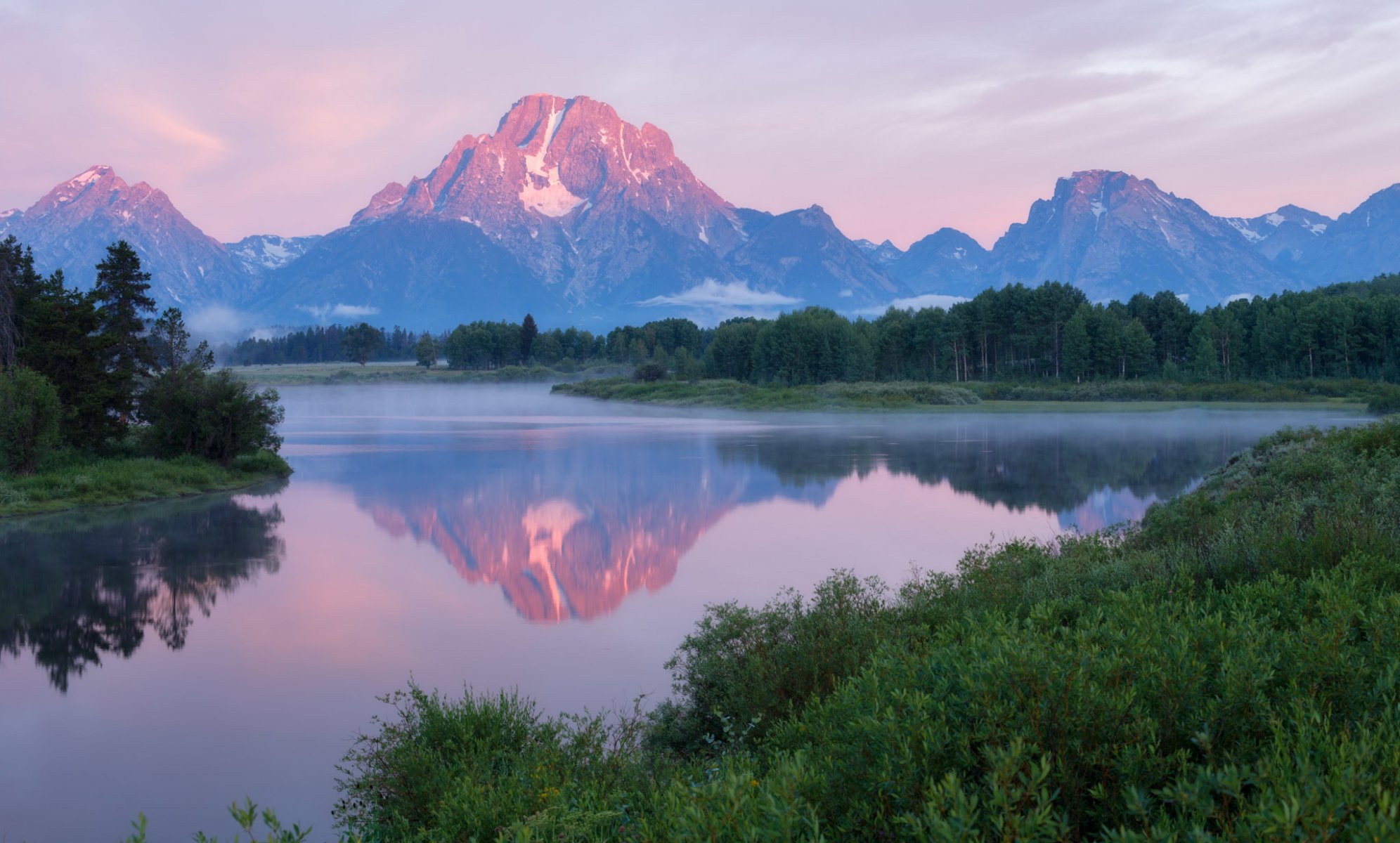 united states wyoming national park grand teton oxbow bend mountain river water forest tree morning fog sky clouds reflection