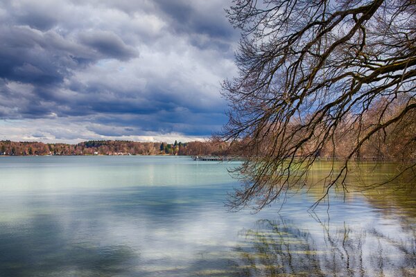 Blue clouds are reflected in the lake