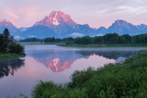 The quiet surface of the river at sunrise