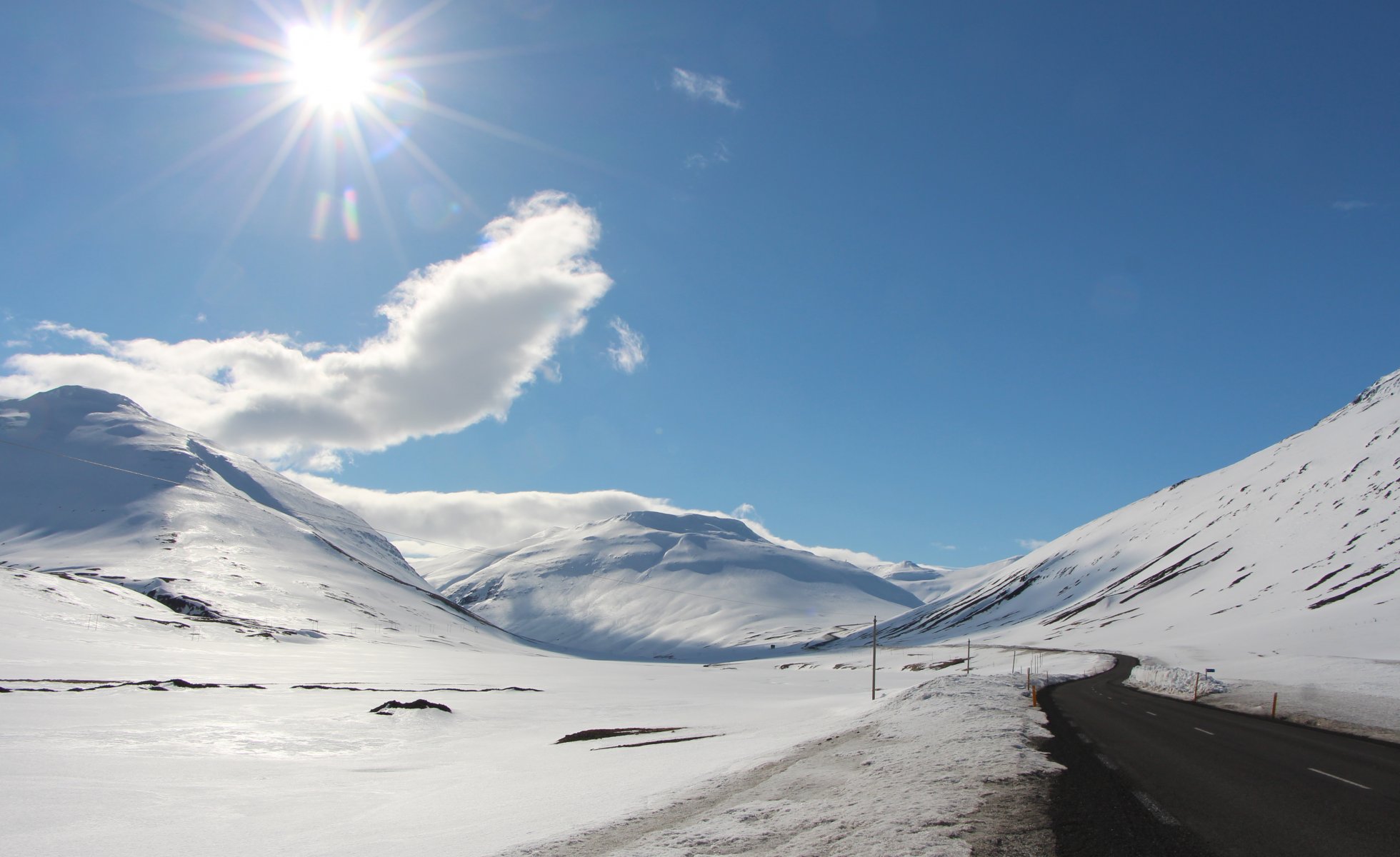 hills snow road sun