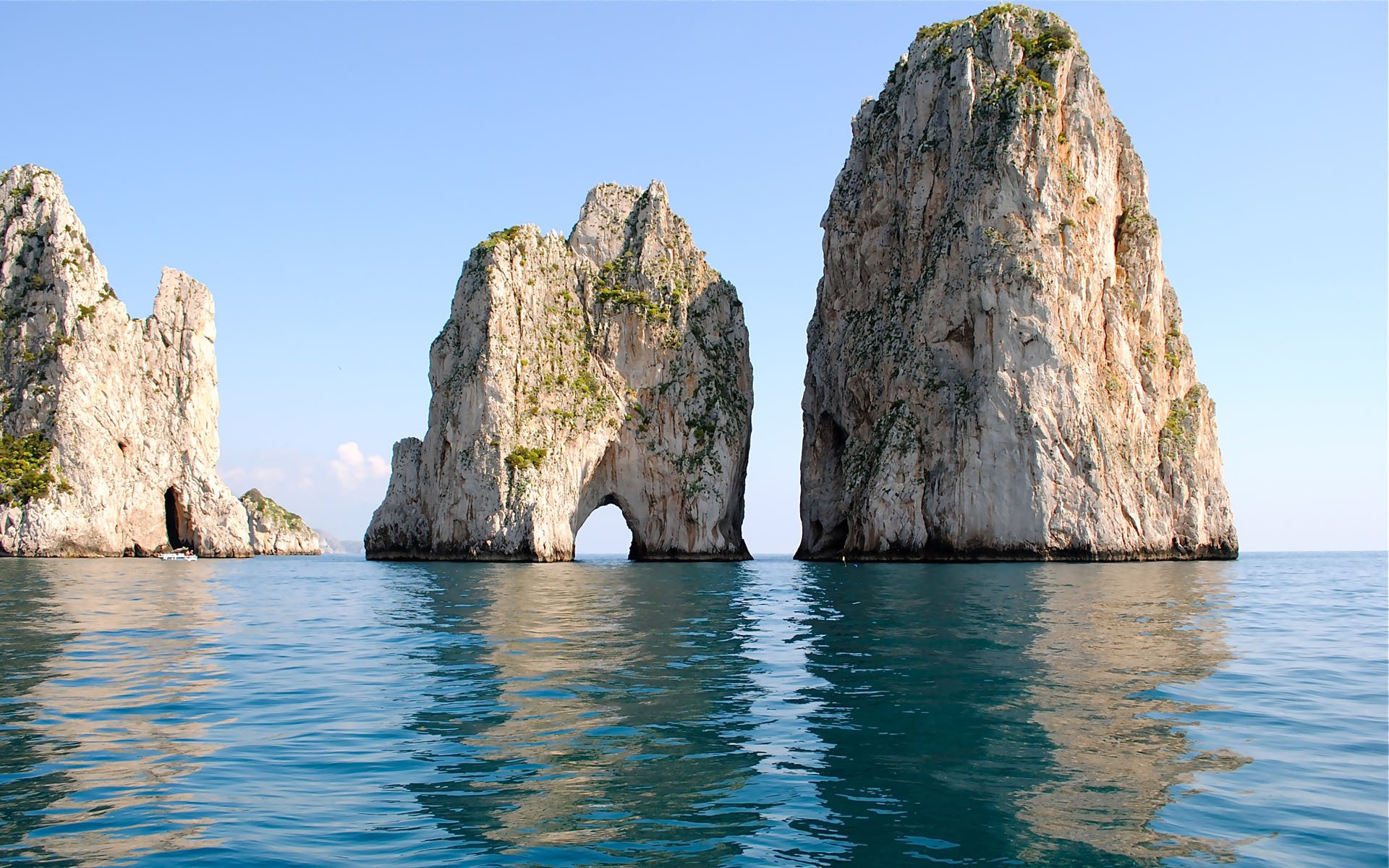 mare rocce arco superficie riflessione oceano