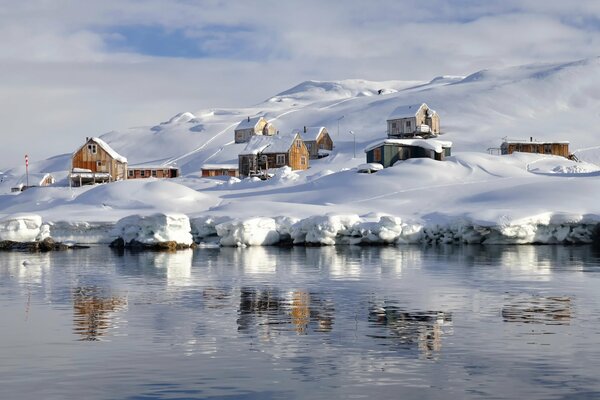 A village in Greenland near a lake
