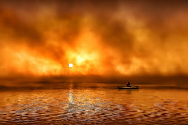 At sunrise in the fog, a man in a boat