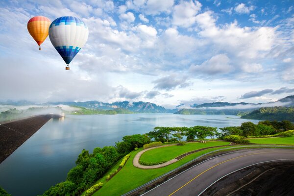 Balloons in the sky with clouds