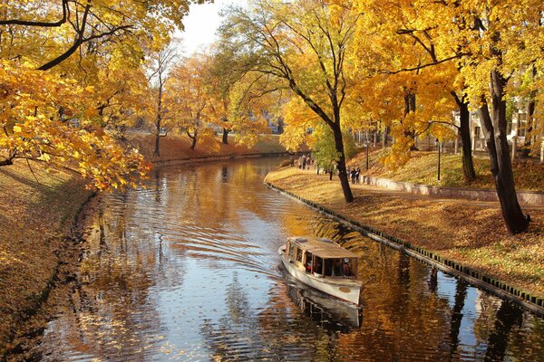 Autumn nature, boat in the canal