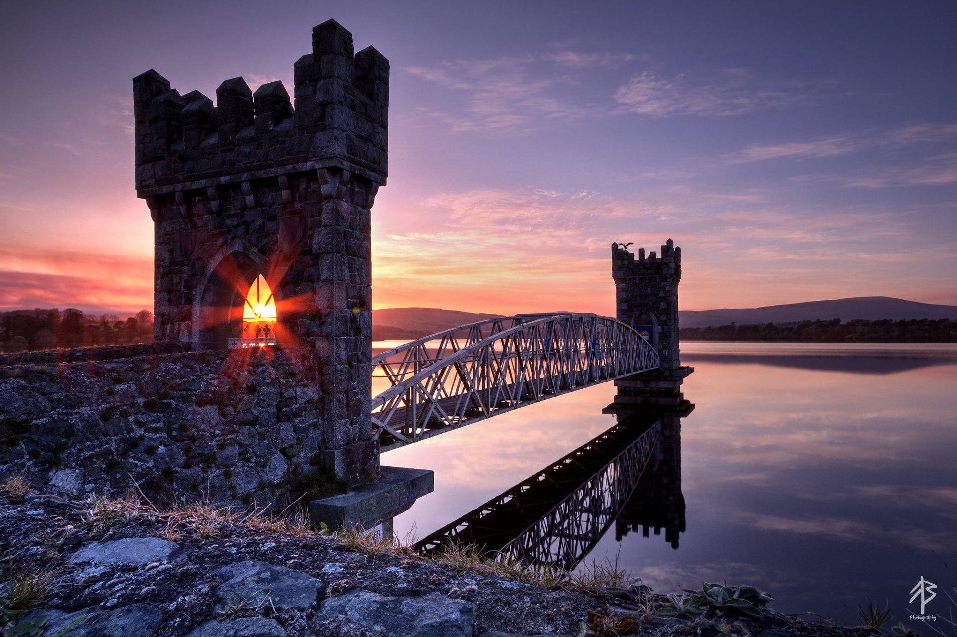 bridge lake fortress sun rays light sunset night