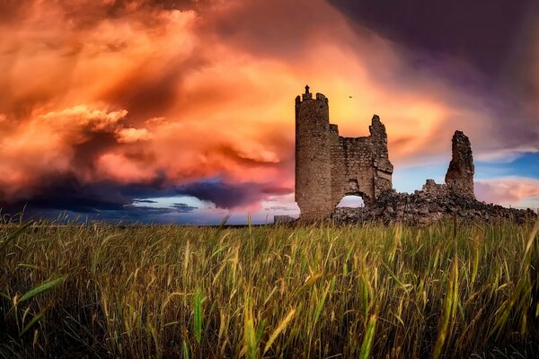 Against the background of the sky, clouds and fields, the ruins smell of mysticism