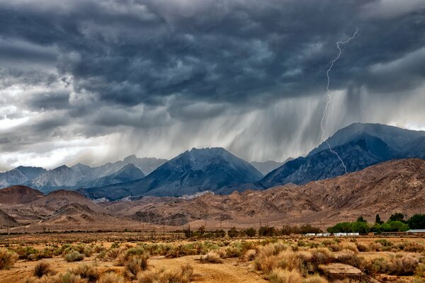 Rain in the desert near the mountains