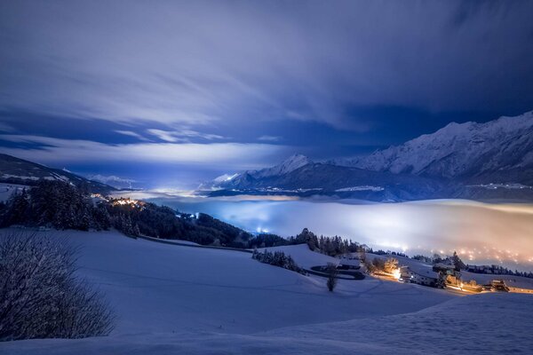 Night mountain valley in the snow