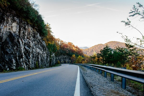 The road through the mountains in autumn