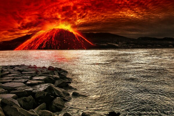 Wybuch wulkanu w morzu przy skałach
