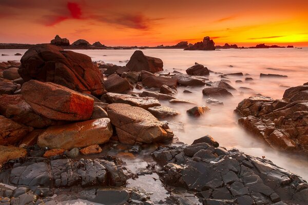 Sunset on the sea with rocks