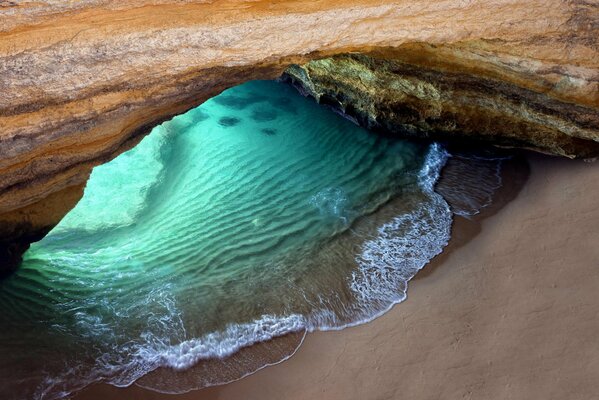 Grotto under a rock in the ocean