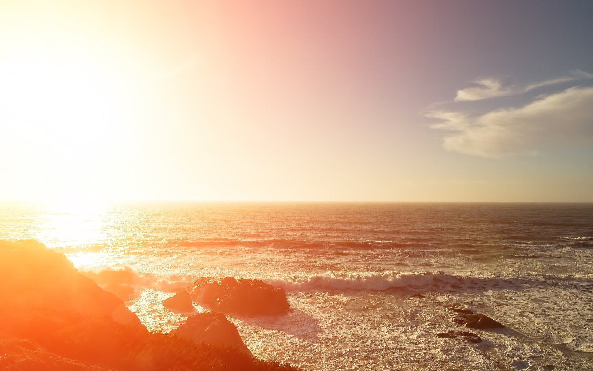 mare sole onde luce pietre