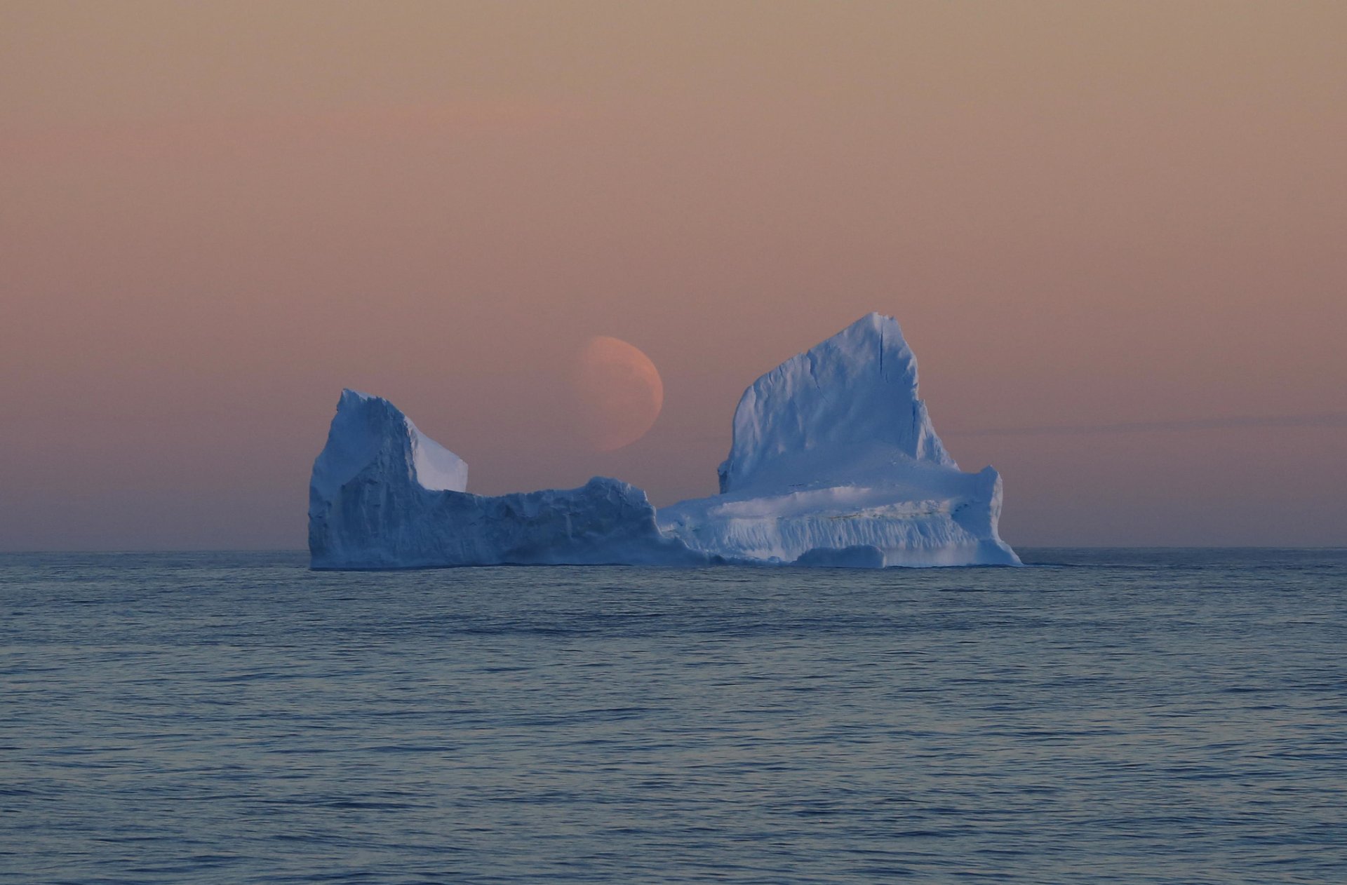 antarctica pacific sector of the southern ocean ross sea iceberg night pale moon