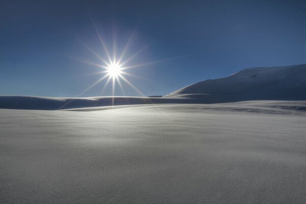 Winter sun in endless snow