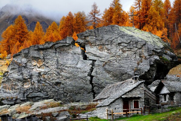 A small house by a split rock