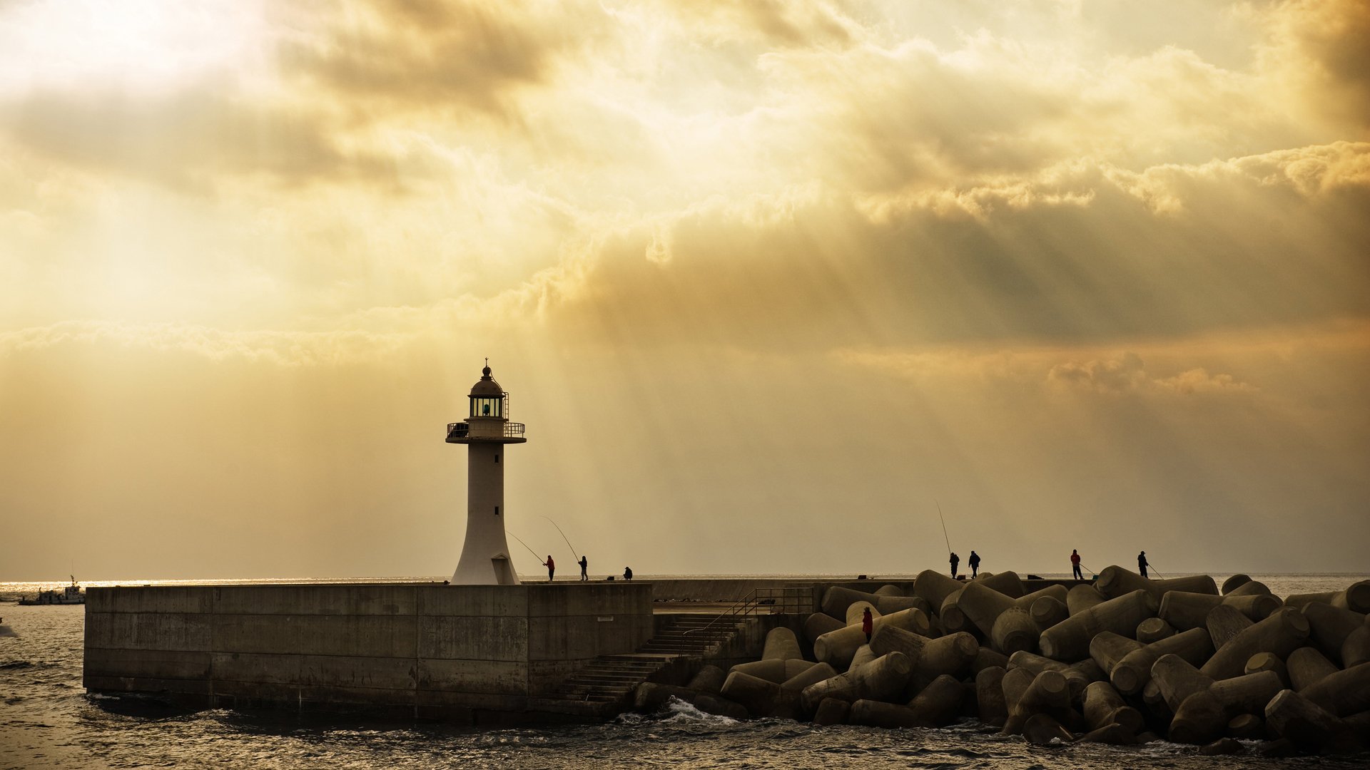 mer phare pêche rayons du soleil