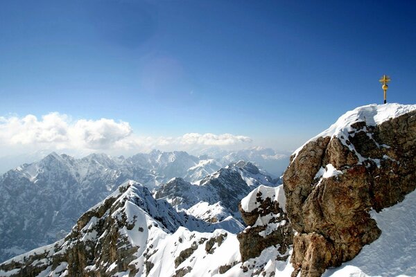 Mountain peak, rocks and cross