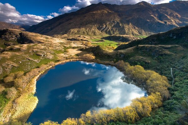 Clouds are reflected in the blue lake