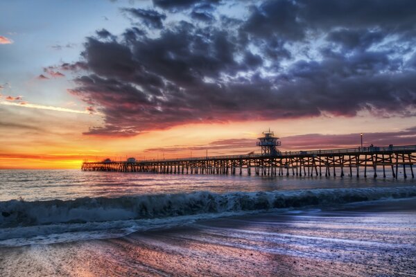 Sunset on the seashore and pier