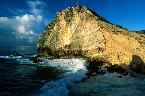 A big rock in the waves of the sea