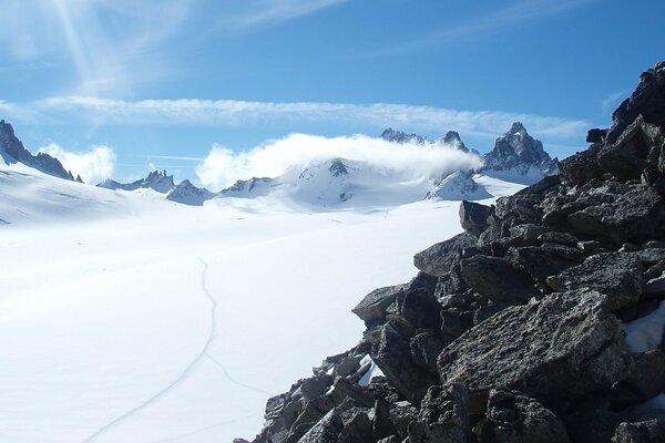 Black stone rock and snow