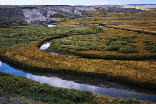 A long winding riverbed in the valley