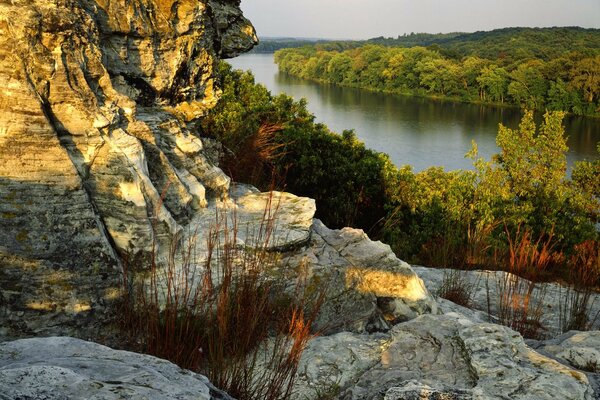 Rocks on the bank of a deep river