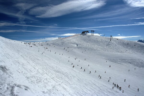 Skiers riding on snow-covered slopes