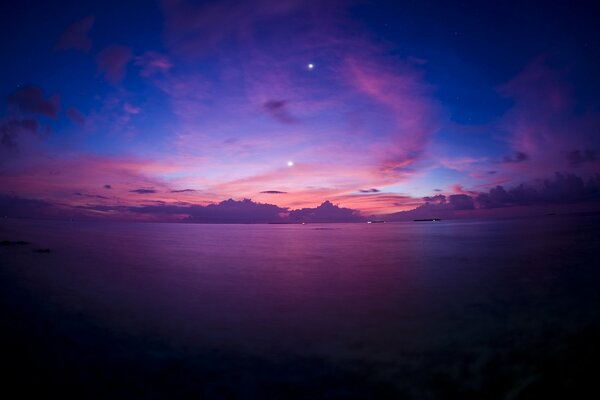 Evening pink sunset by the sea