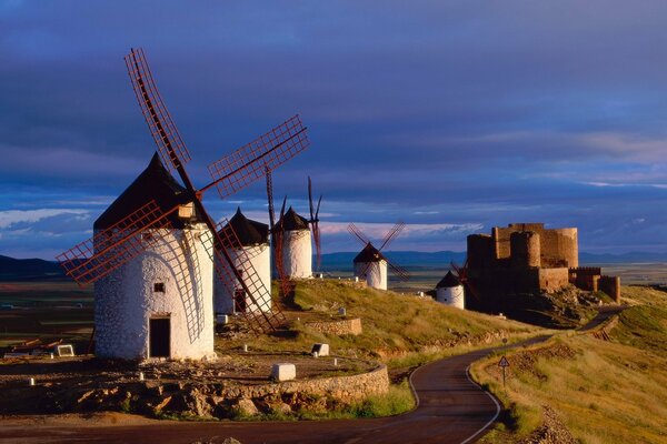 There are mills and a castle next to the road