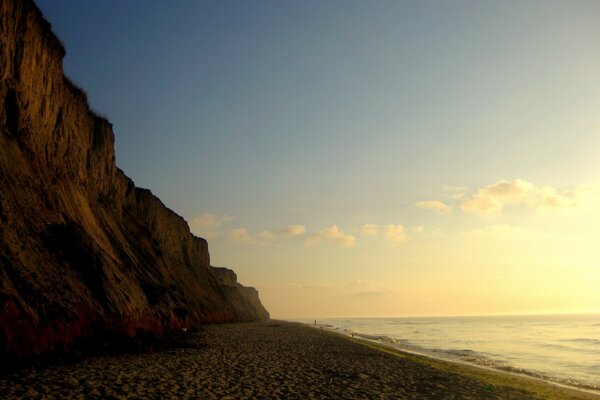 Morning. Seashore and cliff