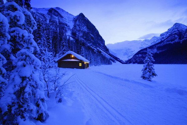 A house in a winter snow-covered forest