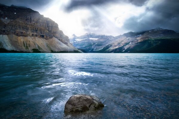 Blue water landscape with mountain view