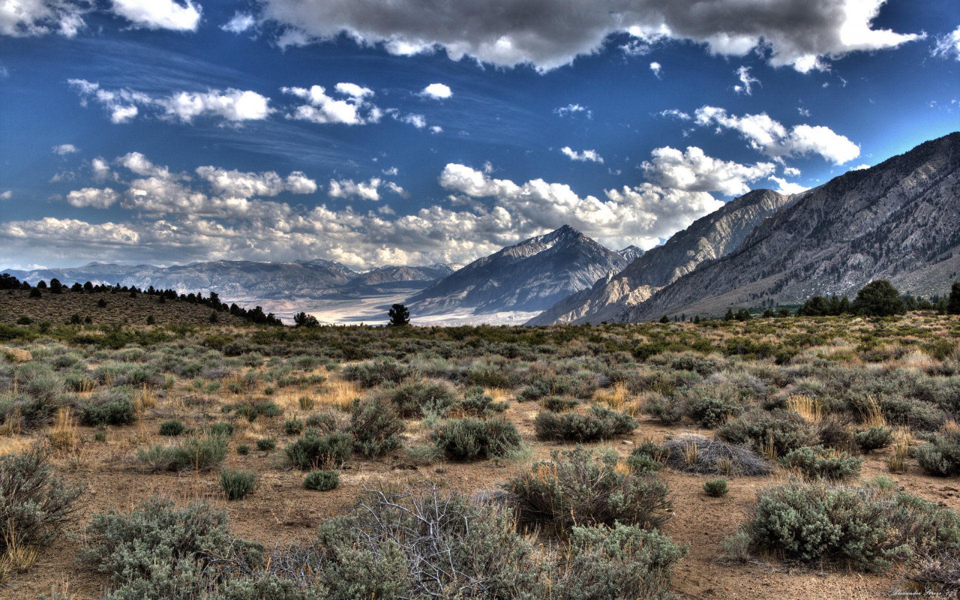 wolken berge gras ebene hdr