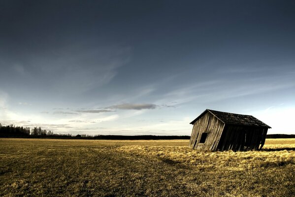 A lonely barn standing in a field
