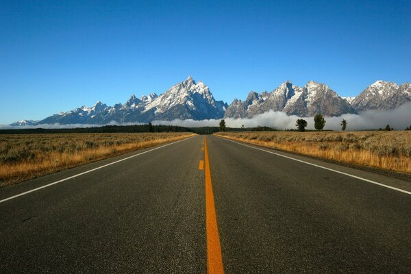 Road markings on the background of mountains