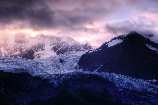 Mountain winter landscape and cloudy sky