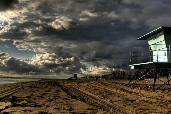 The shore of a sandy beach under beautiful clouds